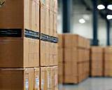 Packages of bicycle components stacked in a warehouse ready for shipping.