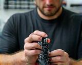 A technician examining a newly manufactured prototype component.